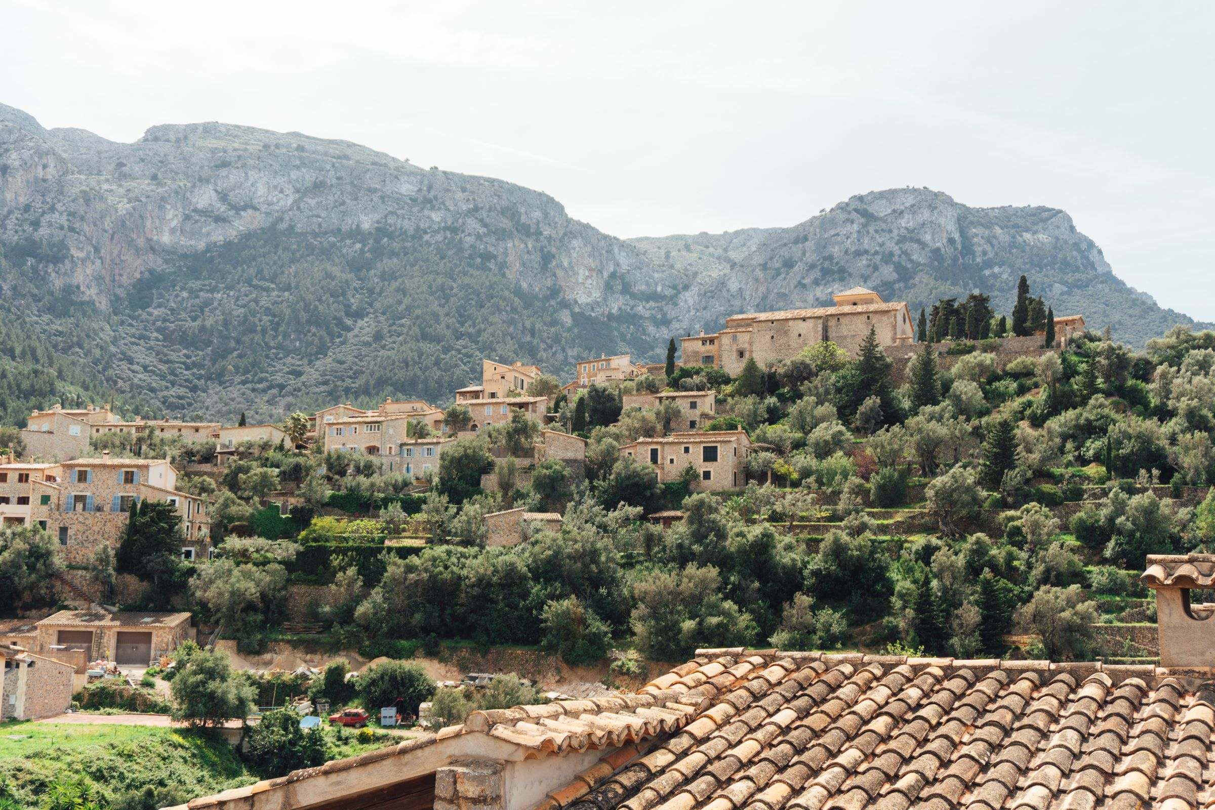 The stone houses of Deià under the Tramuntana mountains