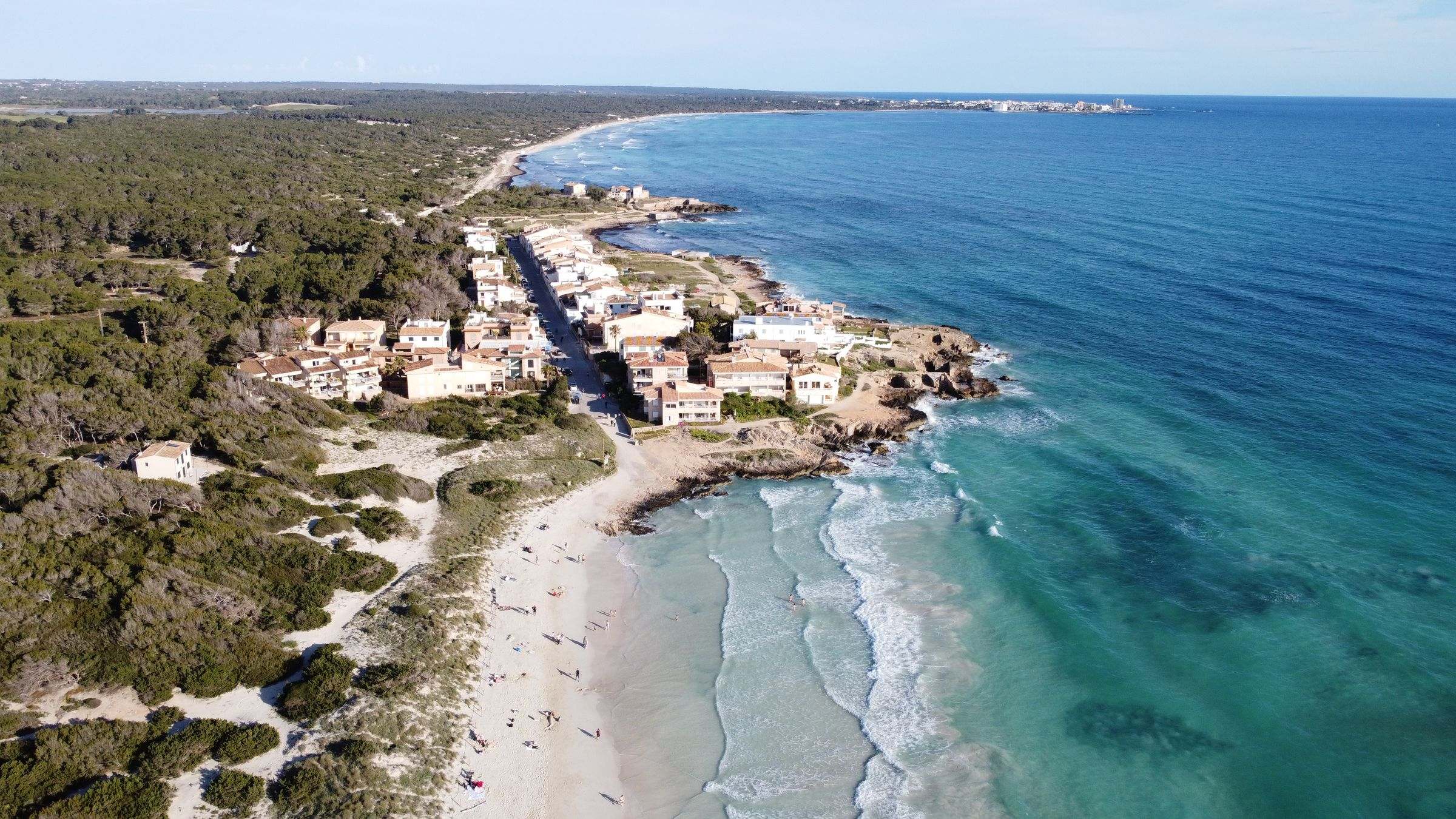 White sand and turquoise water at Es Trenc beach from the air