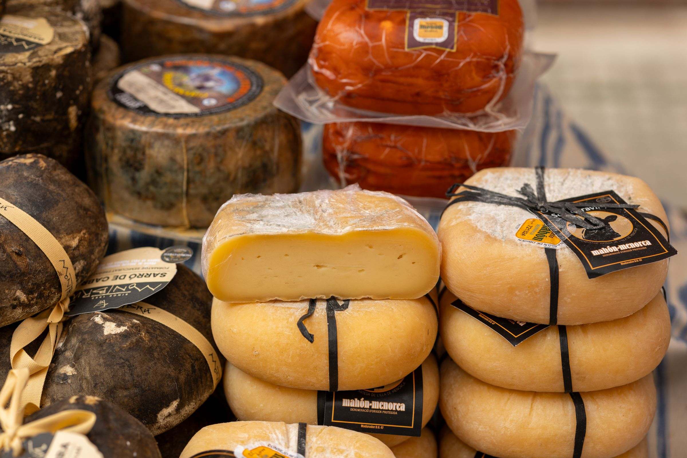 Mallorcan and Menorcan cheeses on a market stall in Palma