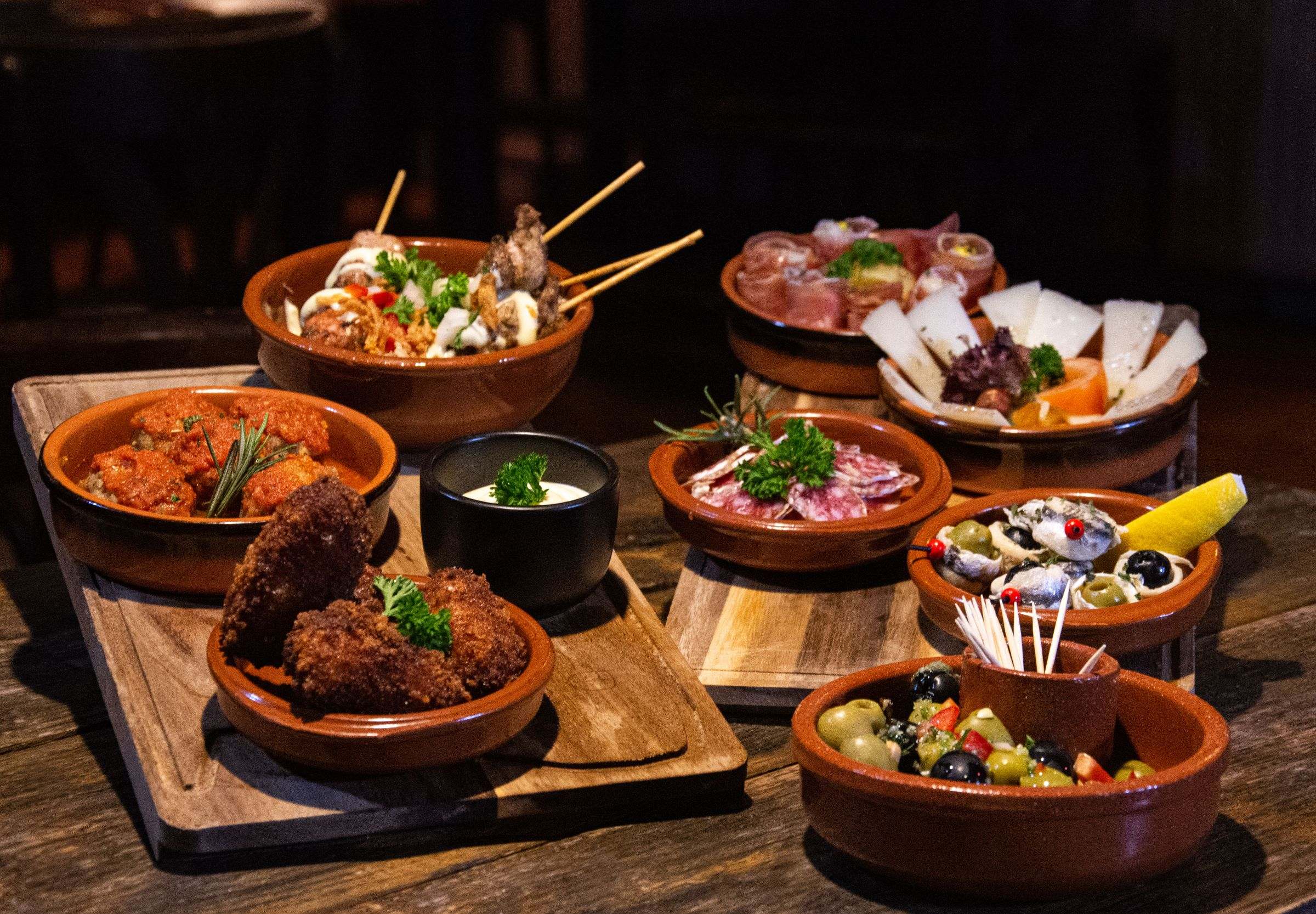Tapas in earthenware dishes